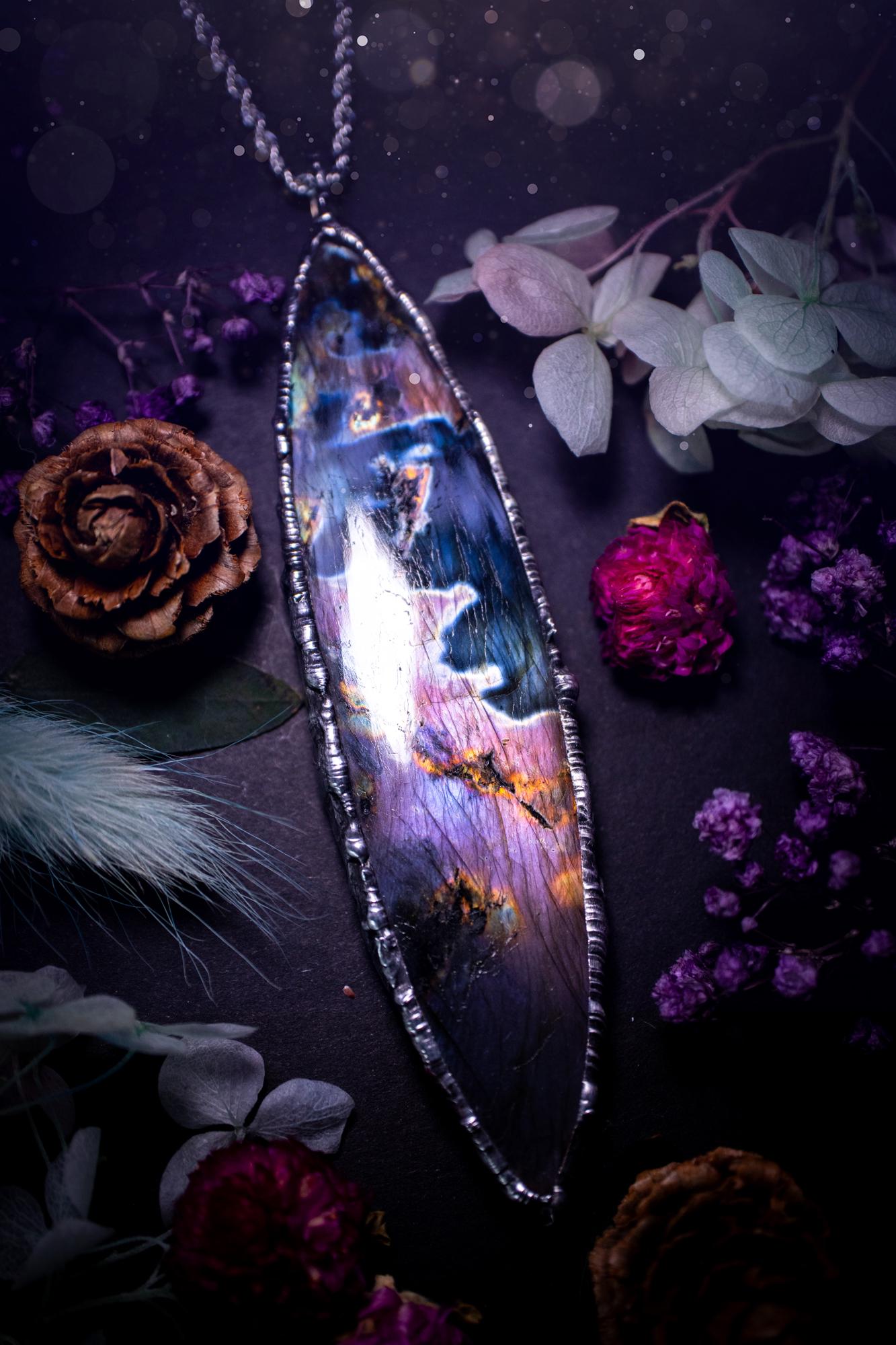 The ultimate labradorite soft soldered pendant necklace. This huge, statement pendant necklace features the most beautiful and natural Labradorite spectrolite crystal that has so many hues of pinks and purples. Handmade using the tiffany technique, also known as soft soldering. This piece is made from solder which contains metals and silver and is safe to wear. The ideal gift for any jewellery lover and crystal collector! Witchy, gothic and hippy jewellery that has been made for the soul.