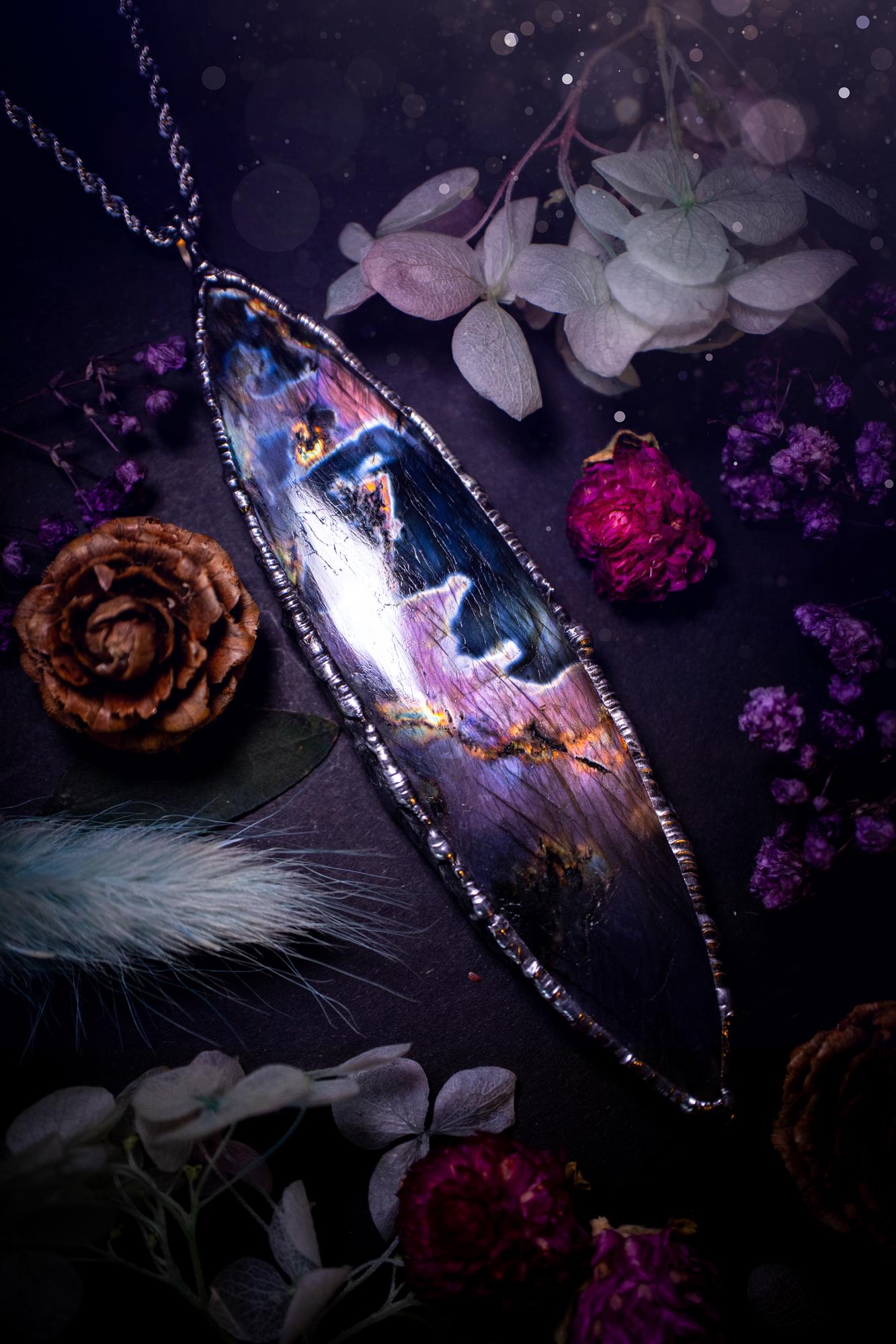 The ultimate labradorite soft soldered pendant necklace. This huge, statement pendant necklace features the most beautiful and natural Labradorite spectrolite crystal that has so many hues of pinks and purples. Handmade using the tiffany technique, also known as soft soldering. This piece is made from solder which contains metals and silver and is safe to wear. The ideal gift for any jewellery lover and crystal collector! Witchy, gothic and hippy jewellery that has been made for the soul.