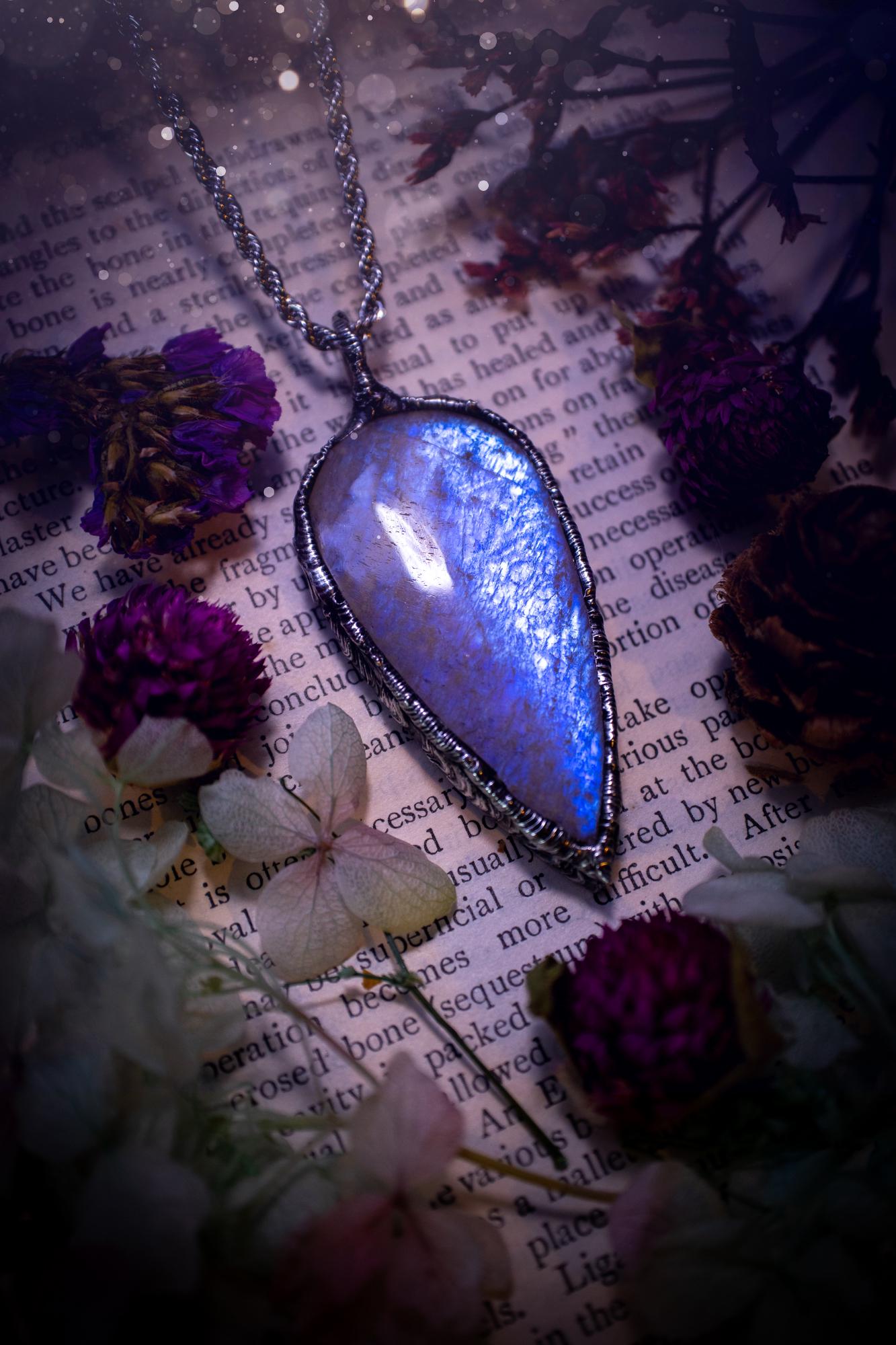 Handmade and beautiful, flashy belomorite, soft soldered pendant necklace. This pendant necklace features the most gorgeous and flashy belomorite moonstone crystal, full of glittery shimmer and a deep lovely blue hue. Handcrafted using the soft solder method, also known as the tiffany technique, an ancient technique used to created stained glass windows. The solder used is lead free and totally safe to wear, it contains elements of silver and polishes up to a high lustre. Gothic witchy jewellery