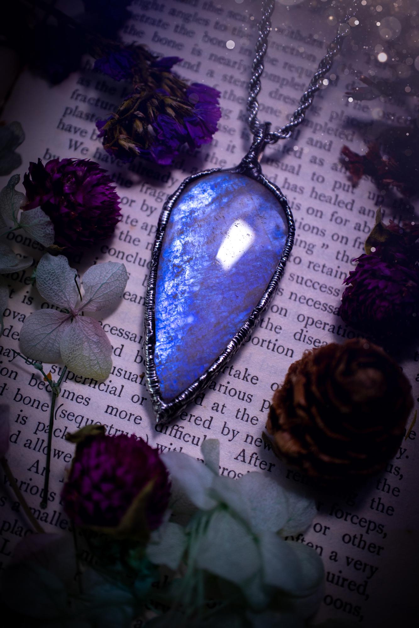 Handmade and beautiful, flashy belomorite, soft soldered pendant necklace. This pendant necklace features the most gorgeous and flashy belomorite moonstone crystal, full of glittery shimmer and a deep lovely blue hue. Handcrafted using the soft solder method, also known as the tiffany technique, an ancient technique used to created stained glass windows. The solder used is lead free and totally safe to wear, it contains elements of silver and polishes up to a high lustre. Gothic witchy jewellery