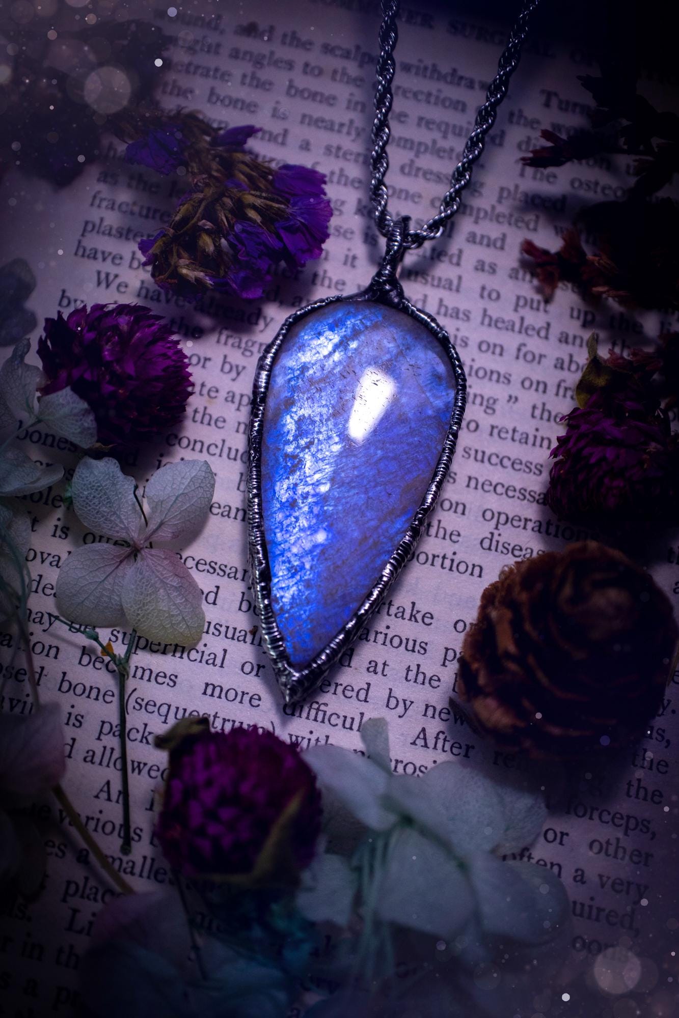 Handmade and beautiful, flashy belomorite, soft soldered pendant necklace. This pendant necklace features the most gorgeous and flashy belomorite moonstone crystal, full of glittery shimmer and a deep lovely blue hue. Handcrafted using the soft solder method, also known as the tiffany technique, an ancient technique used to created stained glass windows. The solder used is lead free and totally safe to wear, it contains elements of silver and polishes up to a high lustre. Gothic witchy jewellery