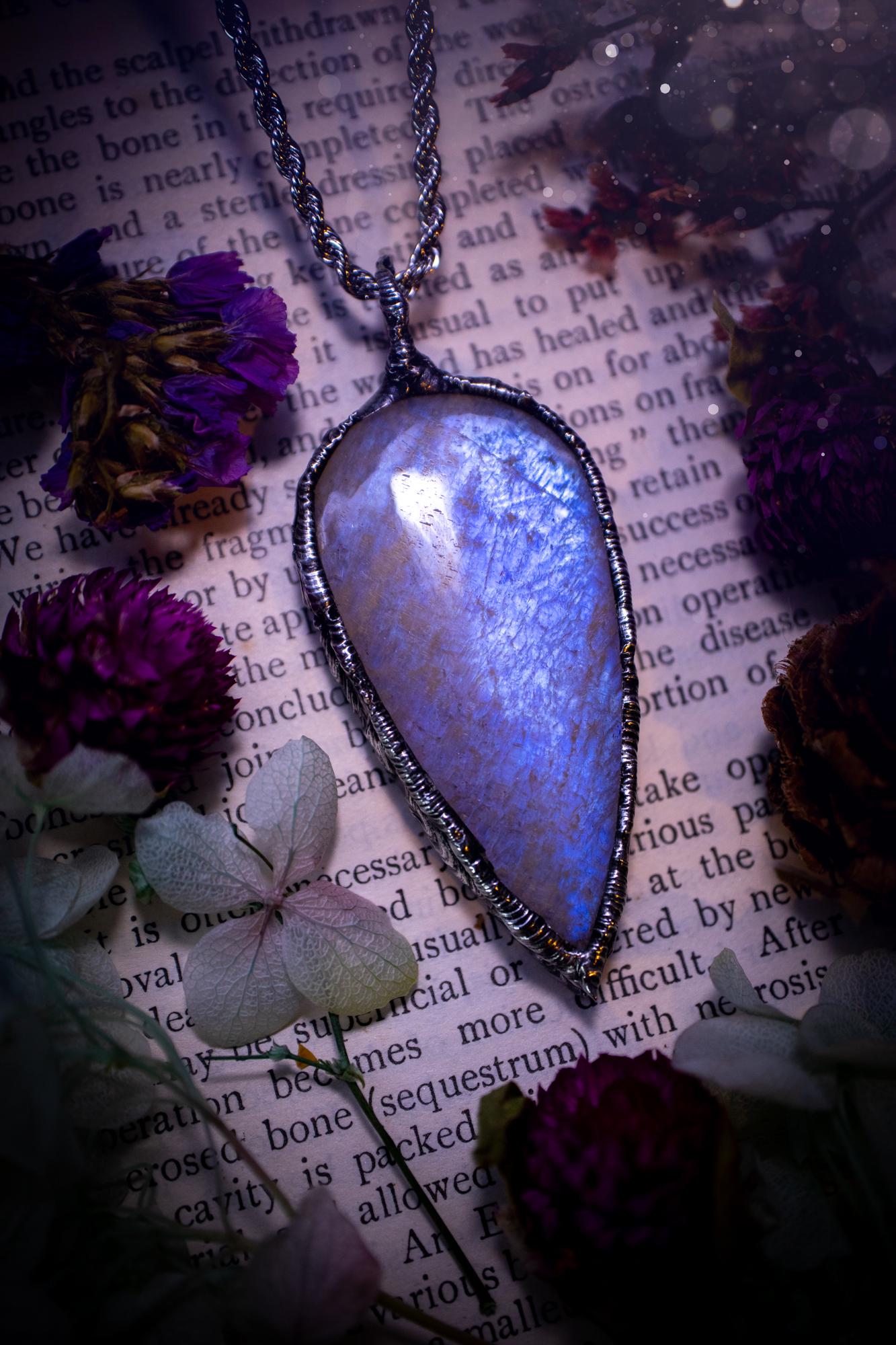 Handmade and beautiful, flashy belomorite, soft soldered pendant necklace. This pendant necklace features the most gorgeous and flashy belomorite moonstone crystal, full of glittery shimmer and a deep lovely blue hue. Handcrafted using the soft solder method, also known as the tiffany technique, an ancient technique used to created stained glass windows. The solder used is lead free and totally safe to wear, it contains elements of silver and polishes up to a high lustre. Gothic witchy jewellery