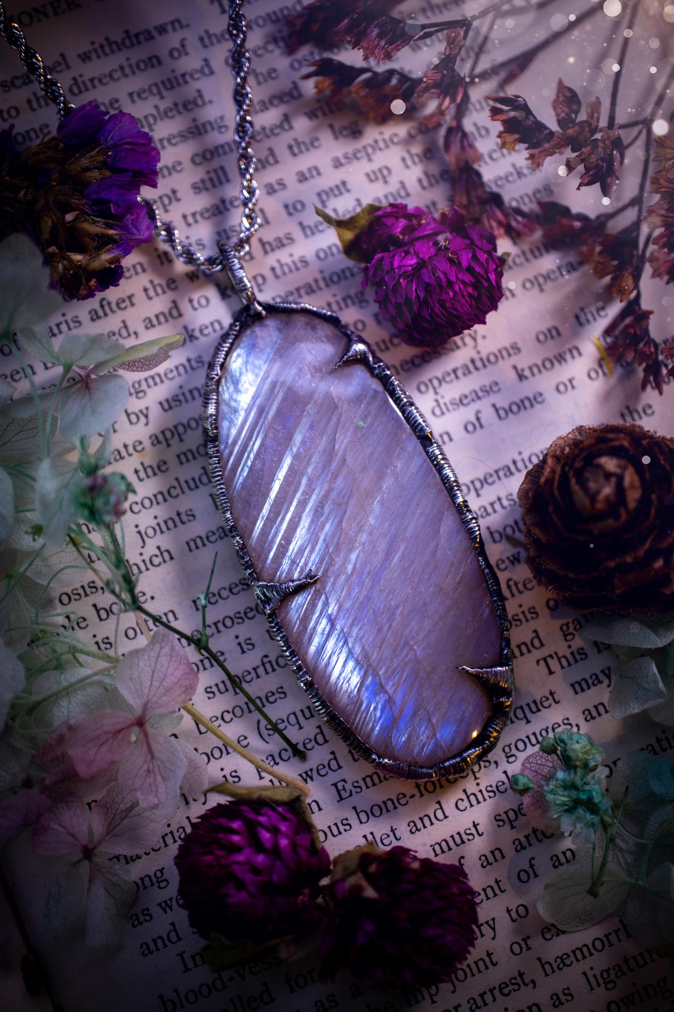 Handmade and beautiful, flashy belomorite, soft soldered pendant necklace. This pendant necklace features the most gorgeous and flashy belomorite moonstone crystal, full of glittery shimmer and a deep lovely blue hue. Handcrafted using the soft solder method, also known as the tiffany technique, an ancient technique used to created stained glass windows. The solder used is lead free and totally safe to wear, it contains elements of silver and polishes up to a high lustre. Gothic witchy jewellery