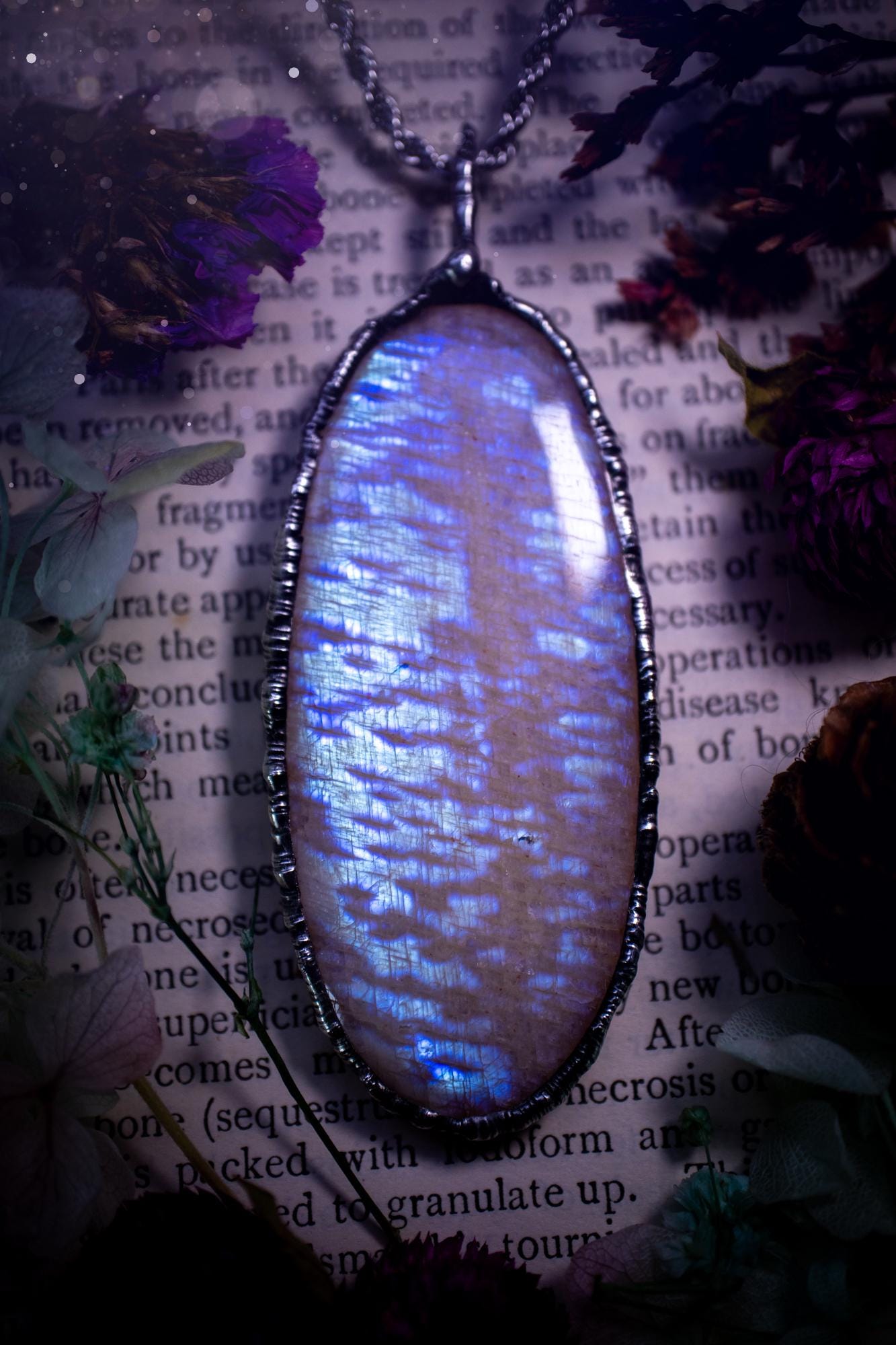 Handmade and beautiful, flashy belomorite, soft soldered pendant necklace. This pendant necklace features the most gorgeous and flashy belomorite moonstone crystal, full of glittery shimmer and a deep lovely blue hue. Handcrafted using the soft solder method, also known as the tiffany technique, an ancient technique used to created stained glass windows. The solder used is lead free and totally safe to wear, it contains elements of silver and polishes up to a high lustre. Gothic witchy jewellery