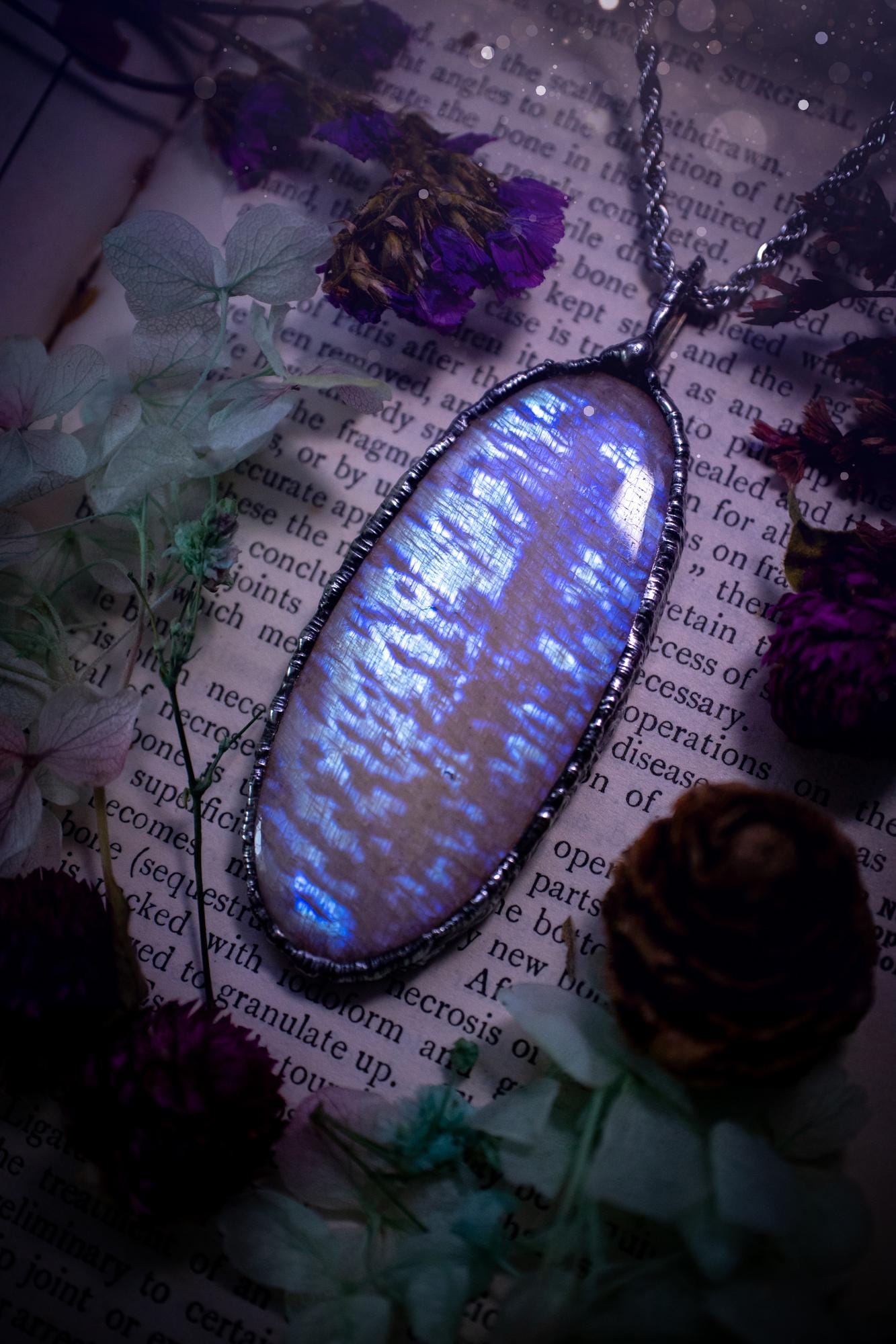 Handmade and beautiful, flashy belomorite, soft soldered pendant necklace. This pendant necklace features the most gorgeous and flashy belomorite moonstone crystal, full of glittery shimmer and a deep lovely blue hue. Handcrafted using the soft solder method, also known as the tiffany technique, an ancient technique used to created stained glass windows. The solder used is lead free and totally safe to wear, it contains elements of silver and polishes up to a high lustre. Gothic witchy jewellery