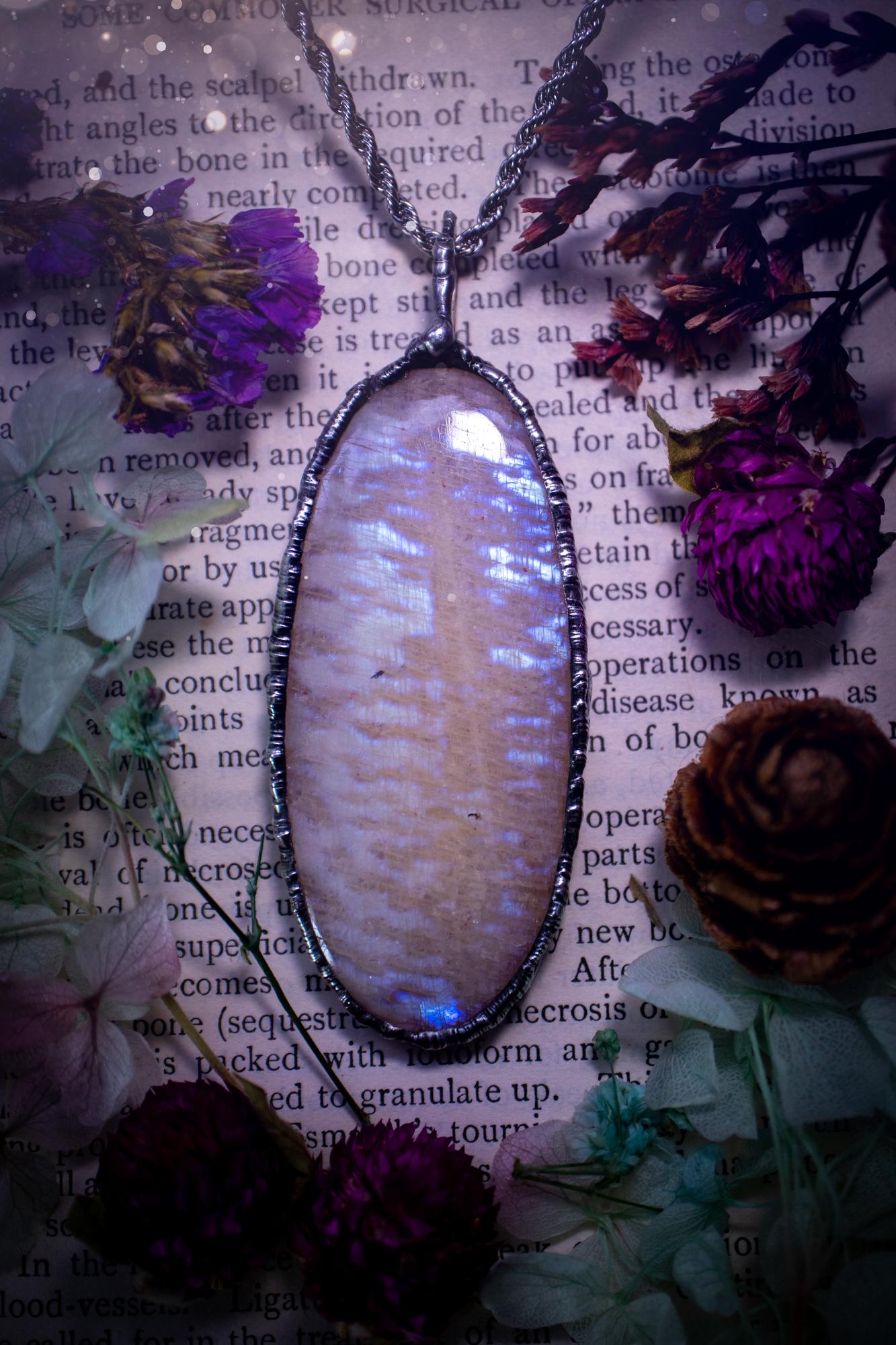 Handmade and beautiful, flashy belomorite, soft soldered pendant necklace. This pendant necklace features the most gorgeous and flashy belomorite moonstone crystal, full of glittery shimmer and a deep lovely blue hue. Handcrafted using the soft solder method, also known as the tiffany technique, an ancient technique used to created stained glass windows. The solder used is lead free and totally safe to wear, it contains elements of silver and polishes up to a high lustre. Gothic witchy jewellery