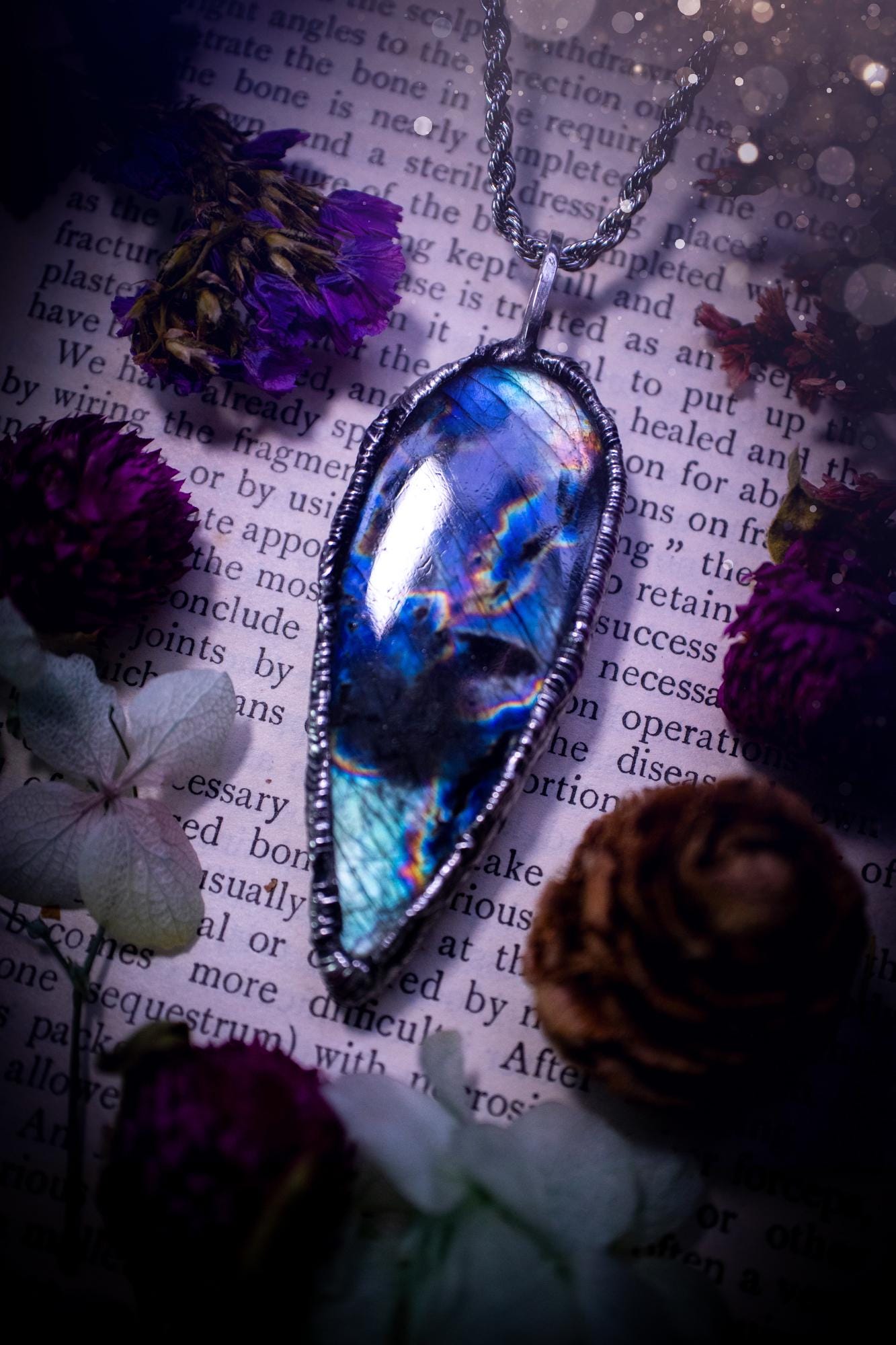A very unique and one of a kind, soft soldered, labradorite, pendant necklace. The labradorite on this pendant is very unique as it is full of green, purples and blues, with little rainbow clusters. It also has two separate flashing areas on the crystal. Very vibrant and beautiful! Handmade using the soft solder method also known as the tiffany technique! This piece of jewellery is a must have for any crystal and jewellery lover, it is full of gothic and witchy vibes! Jewellery for the soul