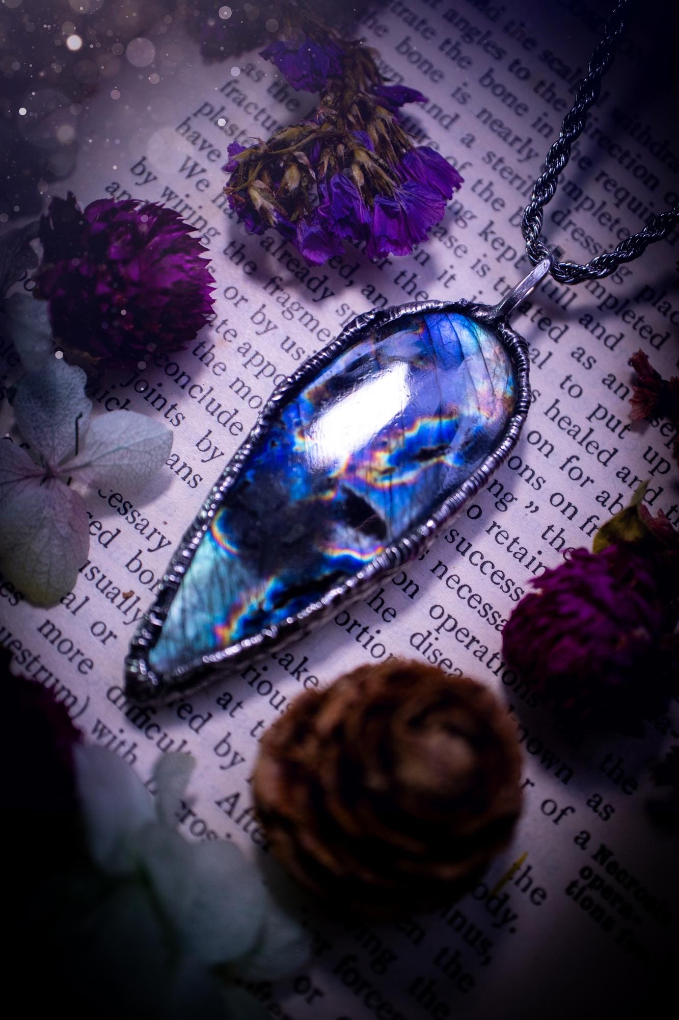 A very unique and one of a kind, soft soldered, labradorite, pendant necklace. The labradorite on this pendant is very unique as it is full of green, purples and blues, with little rainbow clusters. It also has two separate flashing areas on the crystal. Very vibrant and beautiful! Handmade using the soft solder method also known as the tiffany technique! This piece of jewellery is a must have for any crystal and jewellery lover, it is full of gothic and witchy vibes! Jewellery for the soul