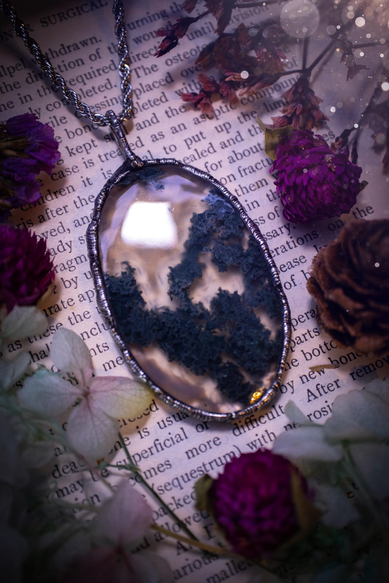Absolutely stunning, and totally unique, moss agate crystal, soft soldered pendant necklace. This beautiful pendant features a very high quality moss agate crystal that has beautiful mossy definition and patterns. The crystal looks like it has a little forest captured inside. This pendant has been made using the soft solder method also known as the tiffany technique. This piece of jewellery would be ideal for any jewellery or crystal lover and is full of hippy, gothic and witchy goodness!