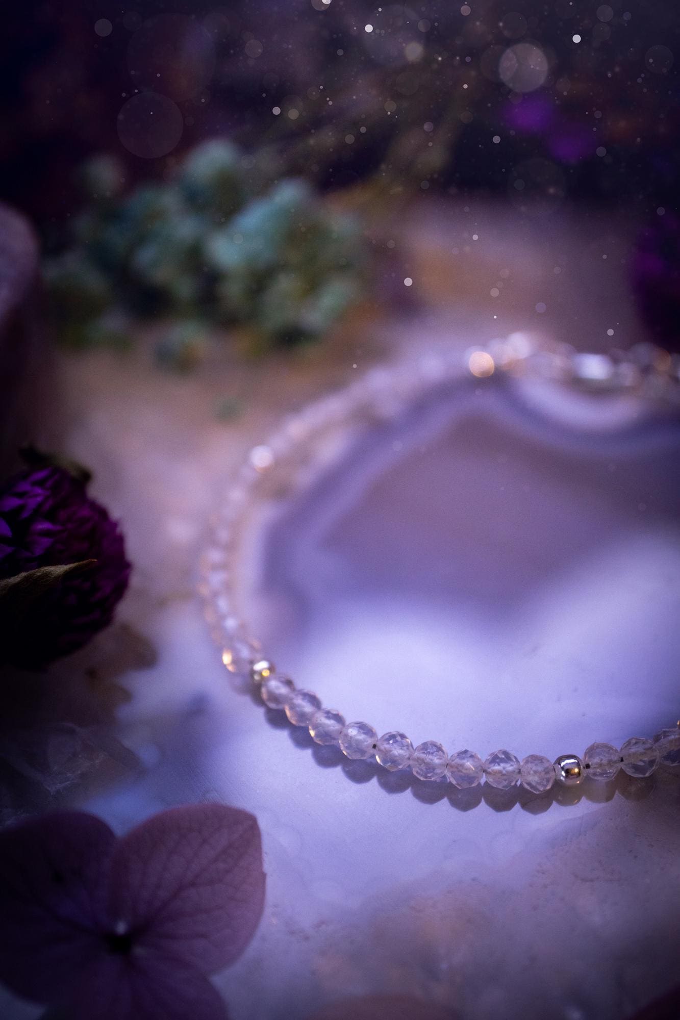 Beautifully handmade, and customisable, clear quartz crystal bead, stacking bracelet. This dainty crystal bracelet features high grade, genuine, rose cut, quartz crystal beads which give off a beautiful sparkle. Strung on 49 strand beading wire with a choice of customisable findings to suit your style. Ideal for gifting, and suitable for any crystal and jewellery lover. Celestial, witchy and gothic.