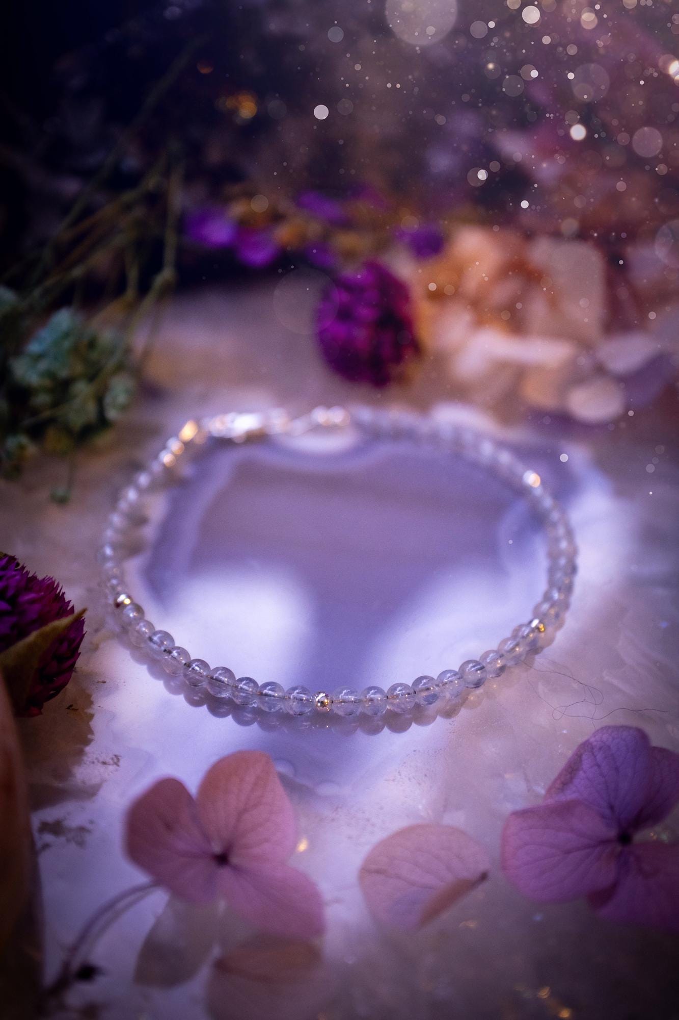 Beautifully handmade, and customisable, high grade aquamarine crystal bead, stacking bracelet. This dainty crystal bracelet features high grade, genuine, smooth, aquamarine crystal beads which give off a beautiful shimmer. Strung on 49 strand beading wire with a choice of customisable findings to suit your style. Ideal for gifting, and suitable for any crystal and jewellery lover. Celestial, witchy and gothic.