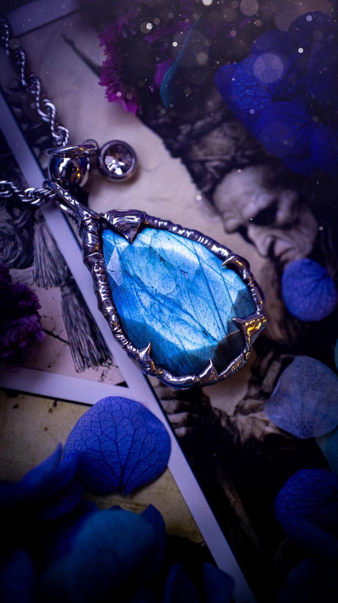 A stunning, and one off pendant necklace. Icy blue labradorite with a facet cut soft soldered pendant. This piece of jewellery has been handmade and features a very high quality, icy blue, natural labradorite crystal. Made using the soft solder method with lead free solder that contains mixed metals including silver. The piece is then polished to a high lustre. Featuring little claws for that gothic and witchy look. Ideal for any crystal and jewellery lover who would like a one of a kind piece.