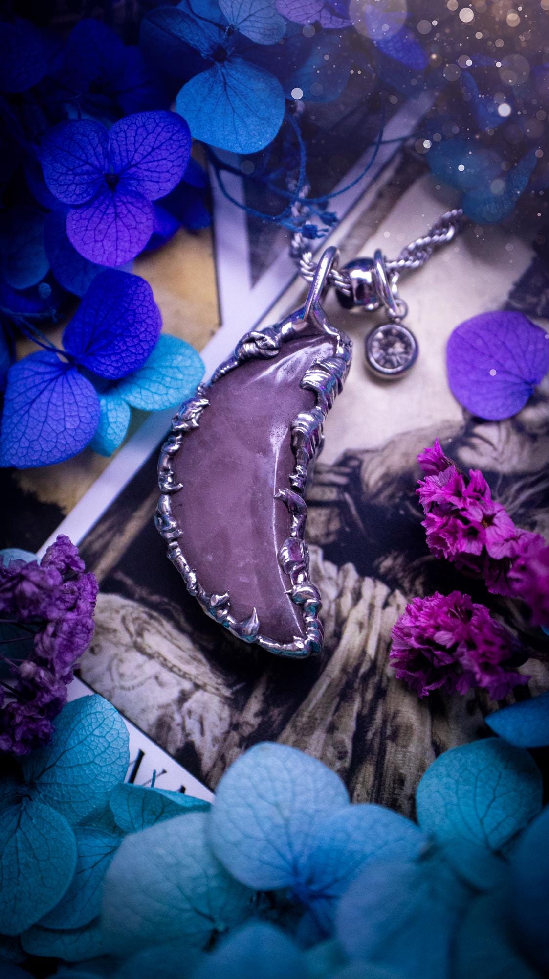 Beautifully bespoke and handcrafted, rose quartz, soft soldered moon pendant necklace. This necklace has been handmade using the soft solder method with lead free solder with mix metals including silver. Featuring a gorgeous rose quartz moon that is a dusty pink colour. This piece is very unique and comes with its own little cubic zirconia charm. This pendant necklace would be suitable for anyone who loves crystals and jewellery, and that also loves a gothic and witchy vibe! Total soul jewellery