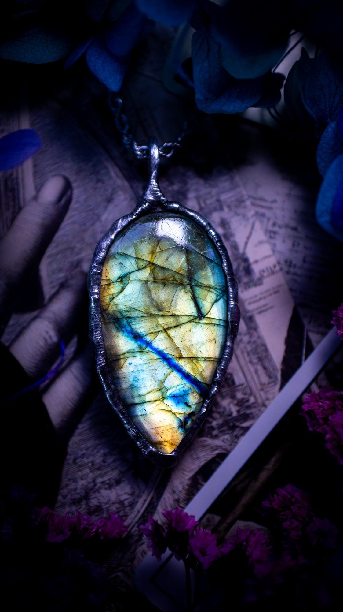 Beautiful, handmade and totally bespoke, green and blue, labradorite crystal, pendant necklace. This jewellery piece has been handcrafted using the soft solder method, using lead free solder that contains silver, then oxidised to create a gothic mystical look. Featuring a beautiful multi flash labradorite crystal with the flash shifting from green to blue. A lovely piece ideal for anyone who loves crystals and jewellery. This is a one of a kind piece with no other the same, gothic design