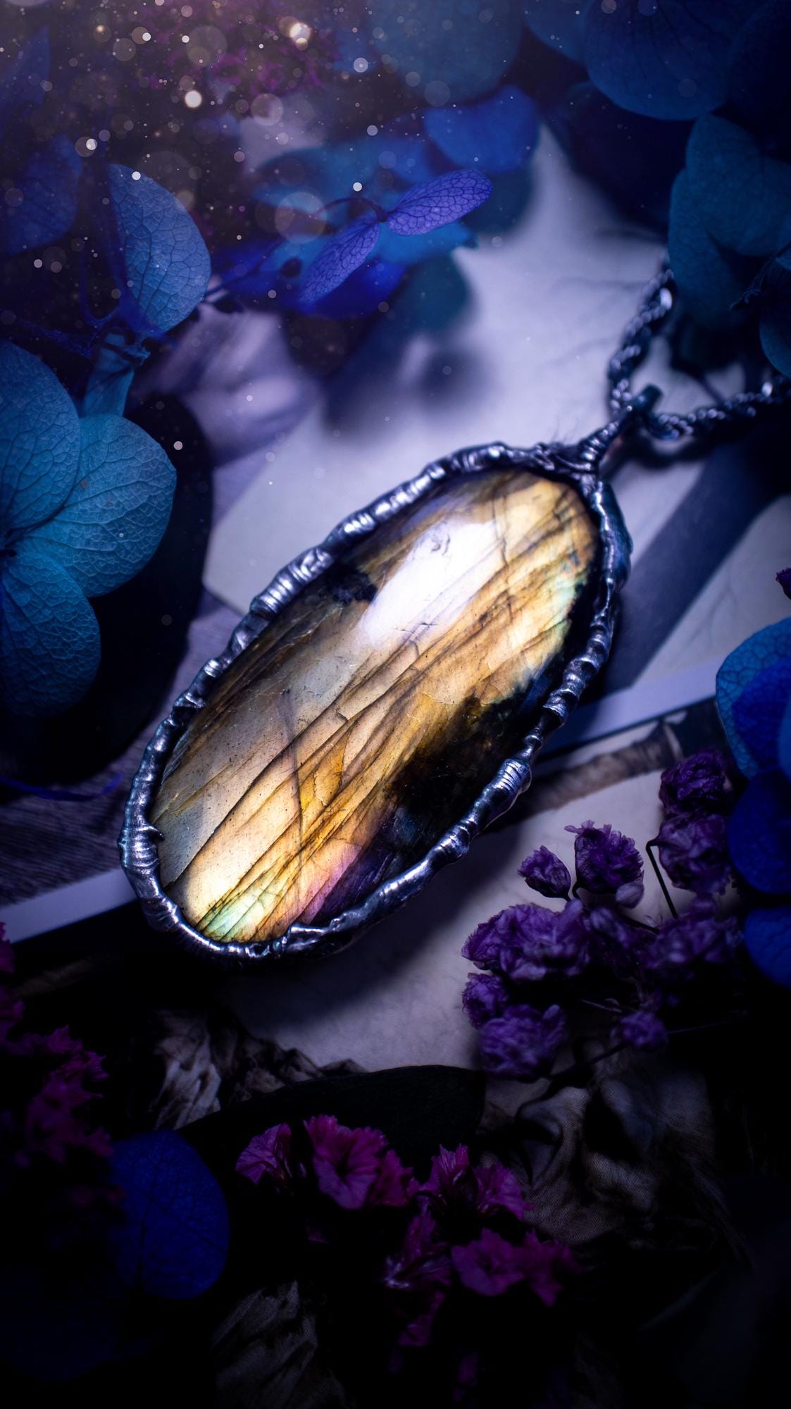 Beautiful, handmade and totally bespoke, orange and yellow, labradorite crystal, pendant necklace. This jewellery piece has been handcrafted using the soft solder method, using lead free solder that contains silver, then oxidised to create a gothic mystical look. Featuring a beautiful multi flash labradorite crystal with the flash shifting from yellow to orange. A lovely piece ideal for anyone who loves crystals and jewellery. This is a one of a kind piece with no other the same, gothic design