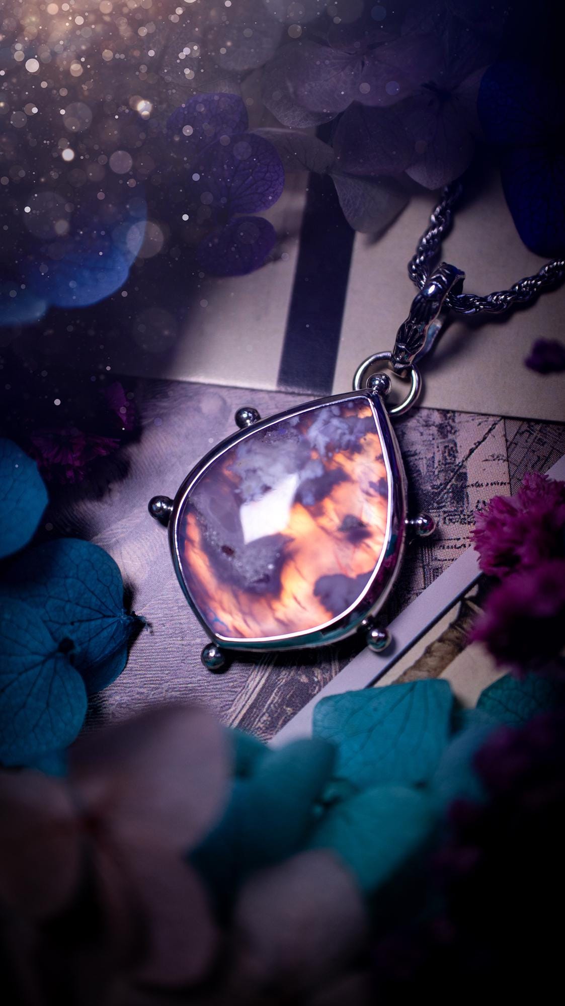 Beautifully handmade, aurora opal doublet and plume agate crystal pendant necklace. This necklace has been made from a mixed of fine and sterling silver. Featuring a stunning and unusual Aurora opal and plume agate doublet that has little tiny druzys, full of beautiful pattern and a glowing pink essence. Around the smooth bezel is some cute little ball details. This piece of jewellery would be ideal for any crystal and jewellery lover how loves unique and alternative pieces! Ideal for gifting