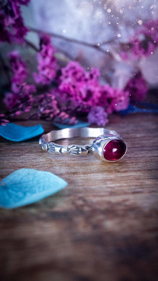 Dainty pink tourmaline stacker ring with a small gemmy natural pink tourmaline gemstone set on a patterned sterling silver band. Handmade with care, this delicate stacking ring features a subtle textured design, perfect for everyday wear or layering with other rings. Feminine and elegant, this minimalist gemstone ring makes a beautiful October birthstone gift or a meaningful addition to any jewellery collection, ideal for lovers of dainty, handmade silver jewellery.
