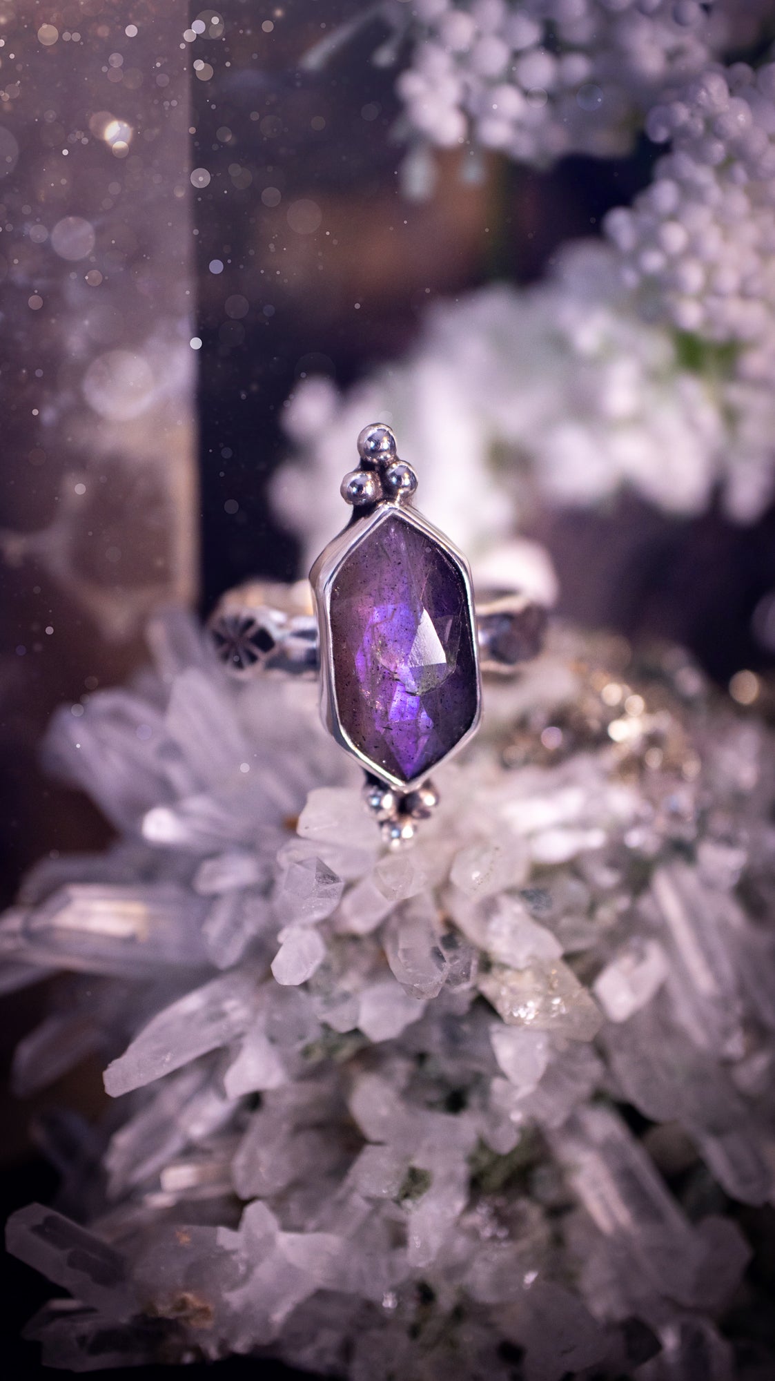 Beautiful, gothic and handmade, purple labradorite crystal statement ring. This ring has been handmade from recycled sterling silver featuring the most beautiful rose cut labradorite that is full of sparkle and purple flash. Mounted on a stamped ring shank. Unique jewellery gifts.