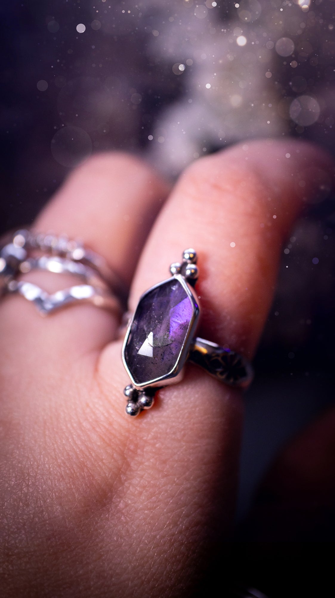 Beautiful, gothic and handmade, purple labradorite crystal statement ring. This ring has been handmade from recycled sterling silver featuring the most beautiful rose cut labradorite that is full of sparkle and purple flash. Mounted on a stamped ring shank. Unique jewellery gifts.