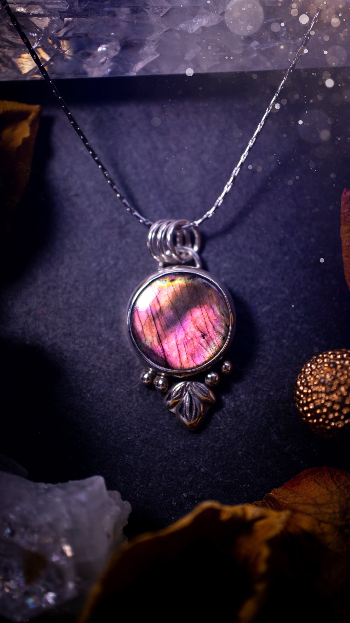 Gorgeous and handmade, sterling silver, purple and orange, labradorite spectrolite pendant necklace. This beautiful necklace features a beautiful labradorite crystal full of colour. Handcrafted from sterling silver that has been recycled. Ideal gift.