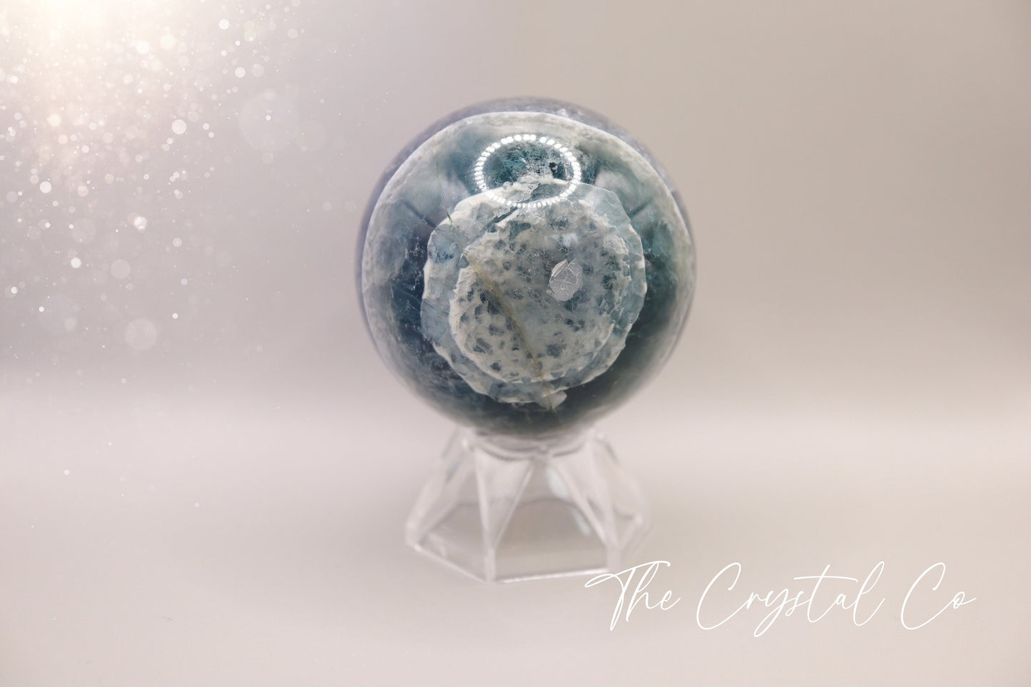 Beautiful real natural crystal, fluorite Sphere. Sizing comes in at 5.9 cm circumference. Weighs 339 grams. Full of beautiful colours and patterns, also has some beautiful rainbows within and feathers. Suitable for meditation, special occasions and gifts. This piece would make the ideal gift for a crystal lover.