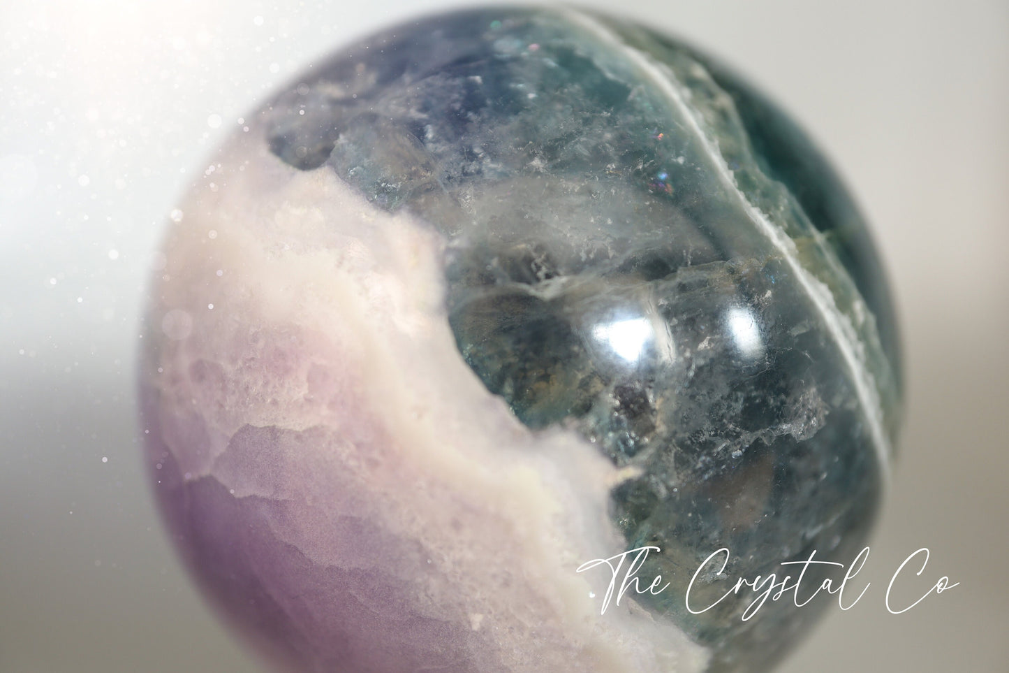 Beautiful real natural crystal, fluorite Sphere. Sizing comes in at 5.9 cm circumference. Weighs 339 grams. Full of beautiful colours and patterns, also has some beautiful rainbows within and feathers. Suitable for meditation, special occasions and gifts. This piece would make the ideal gift for a crystal lover.