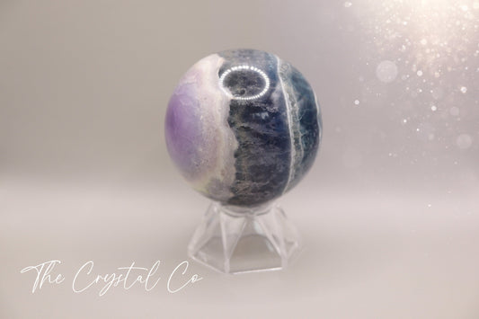 =Beautiful real natural crystal, fluorite Sphere. Sizing comes in at 5.9 cm circumference. Weighs 339 grams. Full of beautiful colours and patterns, also has some beautiful rainbows within and feathers. Suitable for meditation, special occasions and gifts. This piece would make the ideal gift for a crystal lover.