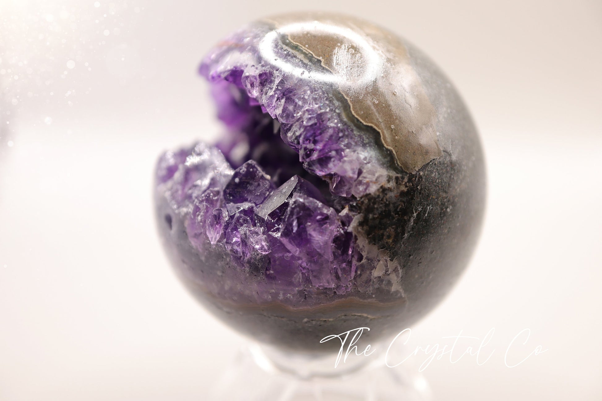 Beautiful, real natural crystal, amethyst cluster sphere. This crystal amethyst is truly gorgeous, featuring deep tone of purple amongst the clusters that are within this sphere. A beautiful piece to add to any crystal collection. Ideal for meditation and healing. 