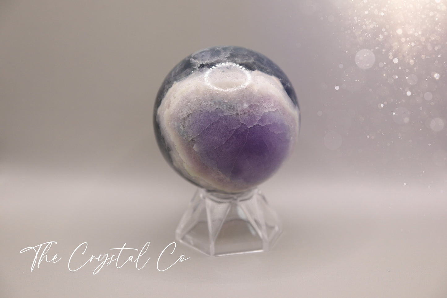 Beautiful real natural crystal, fluorite Sphere. Sizing comes in at 5.9 cm circumference. Weighs 339 grams. Full of beautiful colours and patterns, also has some beautiful rainbows within and feathers. Suitable for meditation, special occasions and gifts. This piece would make the ideal gift for a crystal lover.