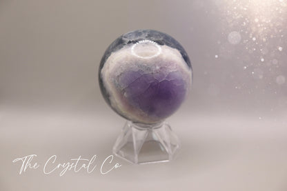 Beautiful real natural crystal, fluorite Sphere. Sizing comes in at 5.9 cm circumference. Weighs 339 grams. Full of beautiful colours and patterns, also has some beautiful rainbows within and feathers. Suitable for meditation, special occasions and gifts. This piece would make the ideal gift for a crystal lover.