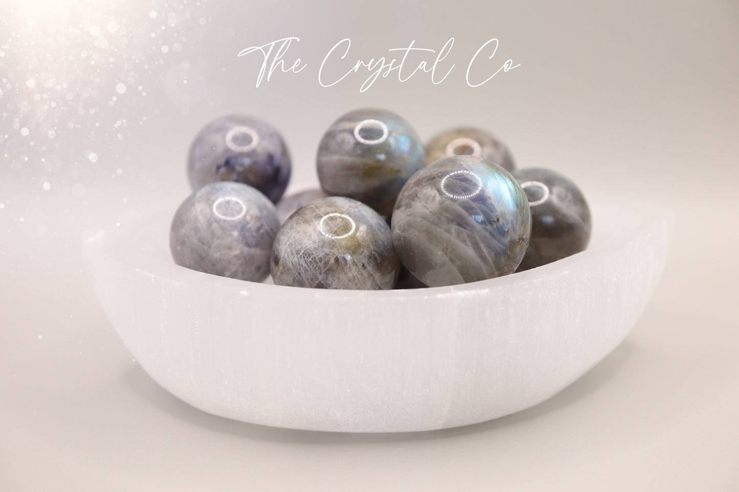 Mini natural labradorite spheres with a flashy iridescent sheen, perfect as pocket crystals or display. Each sphere showcases flashes of blue, green, or gold tones. Hand-polished and sized to fit in the palm, ideal for crystal collectors or gifting