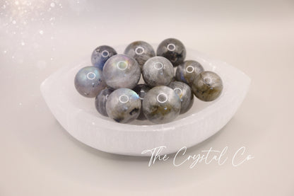 Small sized, labradorite mini crystal spheres. These crystal gemstone spheres are made from natural Labradorite and are very flashy in colour. An array of blues, purples and oranges. Ideal as a pocket crystal and gifting to crystal lovers.