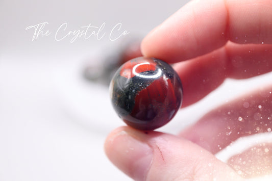 Beautiful, African Bloodstone small and medium pocket spheres. Full of beautiful red speckles, and gorgeous patterns. Some have little inclusions of Pyrite. Ideal as pocket crystals, meditation, and healing. Perfect as little gifts for crystal lovers.