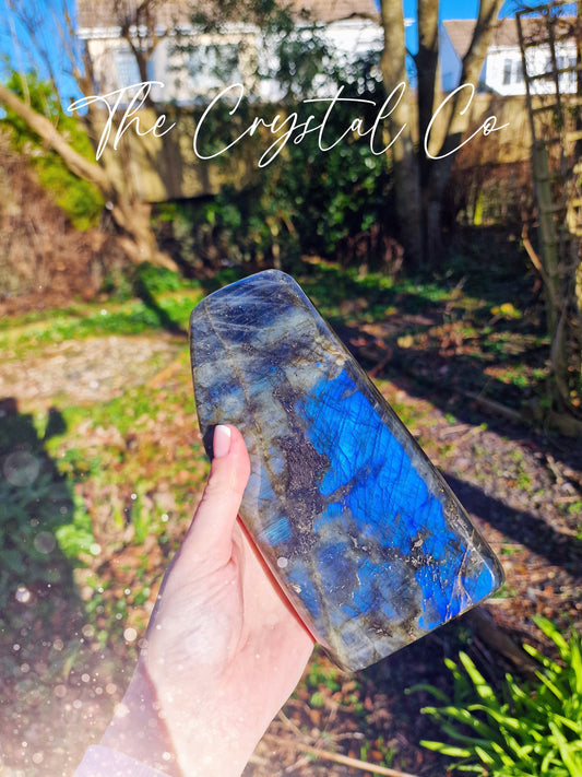 Stunning and natural, deep electric blue, labradorite crystal free form. This labradorite is large in size and has the most vivid blue flash. A very large piece that will be ideal for any crystal collection. Ideal for gifting and home decor