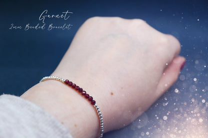 Beautiful and handmade, little crystal garnet stacking bracelet. Featuring faceted natural garnet crystal beads, strung onto elastic with silver plated bead. Garnet is the birthstone for January. Complete with properties card. Ideal crystal gifts.