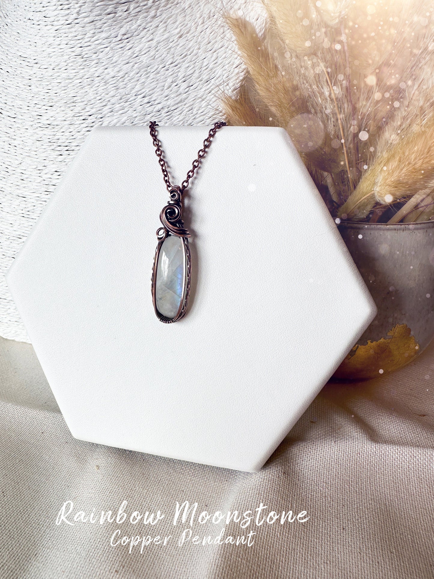 Beautifully hand wrapped, rainbow moonstone, copper pendant necklace. This pendant features a beautiful rainbow moonstone which is the birthstone for June. Wrapped in copper wire into a gorgeous pendant. Ideal for crystal and jewellery lovers. Gothic