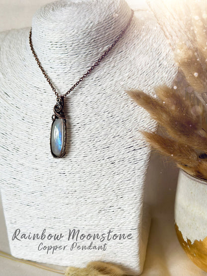 Beautifully hand wrapped, rainbow moonstone, copper pendant necklace. This pendant features a beautiful rainbow moonstone which is the birthstone for June. Wrapped in copper wire into a gorgeous pendant. Ideal for crystal and jewellery lovers. Gothic