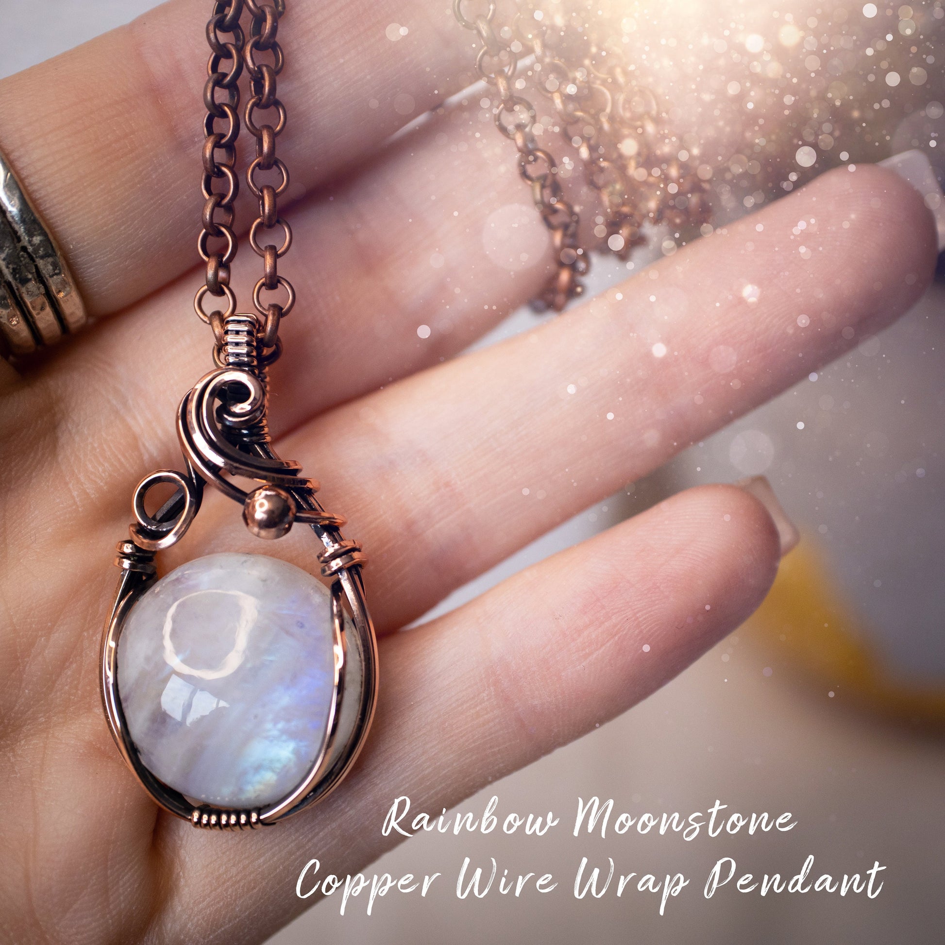 This is a one of a kind, handmade copper wire wrap pendant which features a natural flashy rainbow moonstone crystal. The rainbow moonstone crystal has a beautiful blue flash from different angles and compliments the highly polished, antiqued copper wire which shines luxury! Ideal gift for special occasions