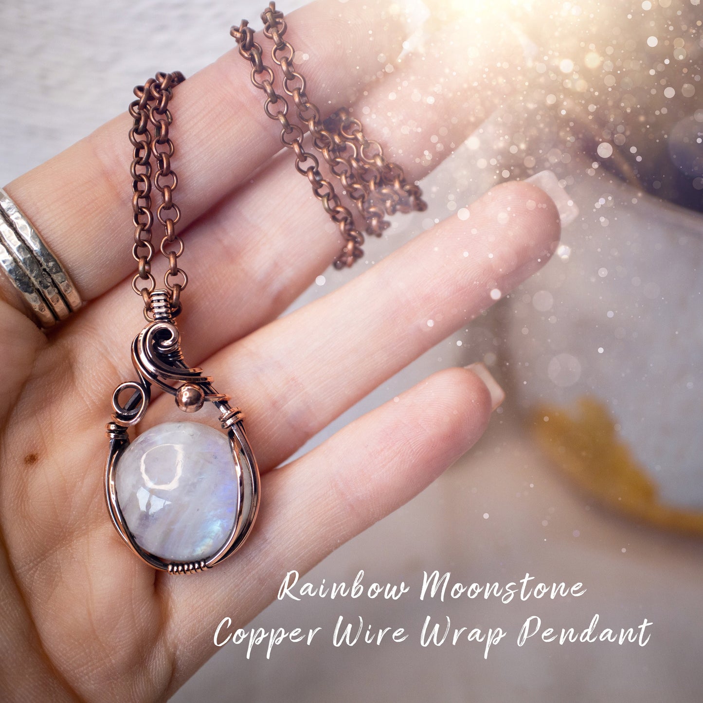 This is a one of a kind, handmade copper wire wrap pendant which features a natural flashy rainbow moonstone crystal. The rainbow moonstone crystal has a beautiful blue flash from different angles and compliments the highly polished, antiqued copper wire which shines luxury! Ideal gift for special occasions