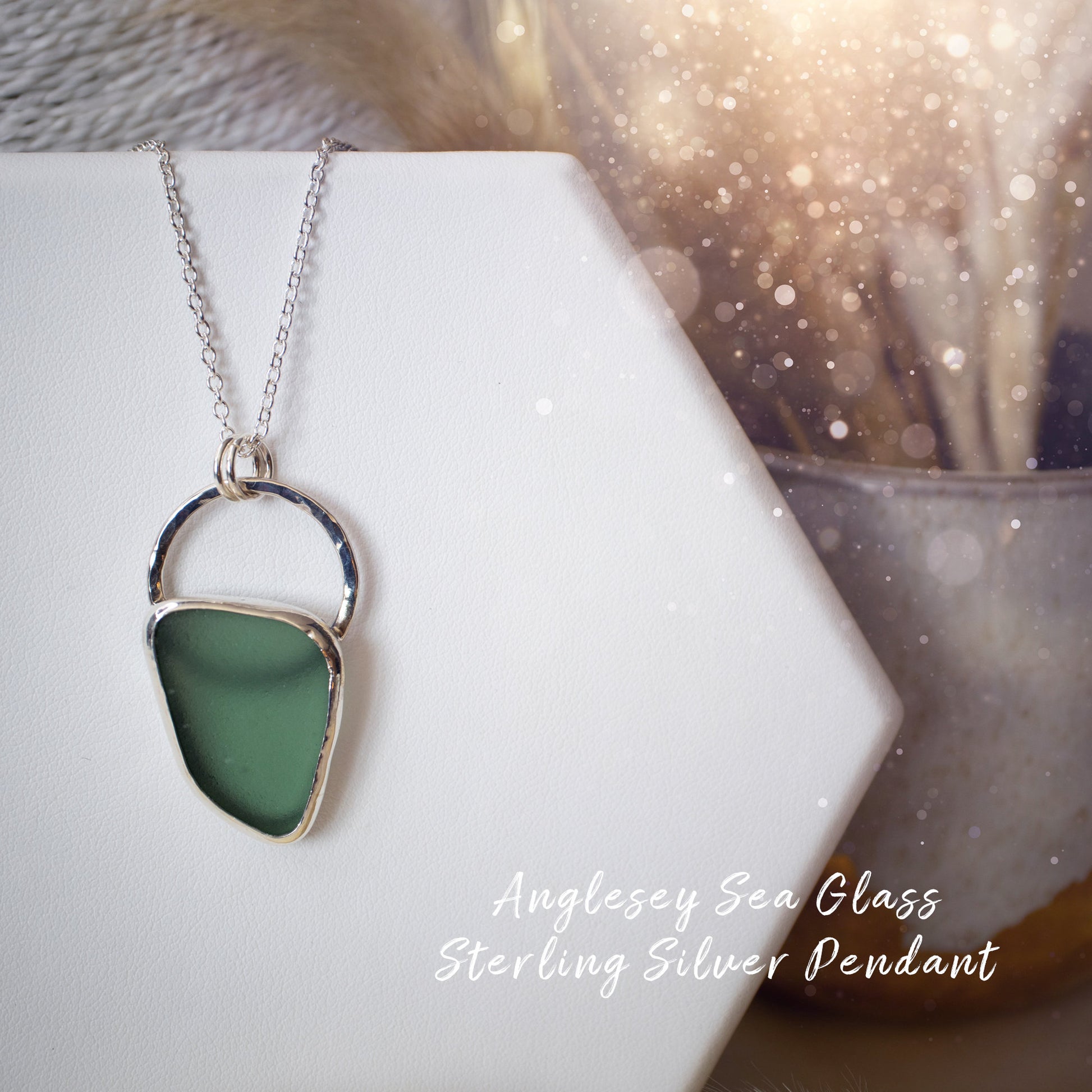 Beautiful deep green sea glass pendant set in 925 sterling silver and 999 fine silver. Featuring sea glass which has been hand picked off the local beaches in Anglesey North Wales