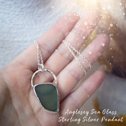 Beautiful deep green sea glass pendant set in 925 sterling silver and 999 fine silver. Featuring sea glass which has been hand picked off the local beaches in Anglesey North Wales