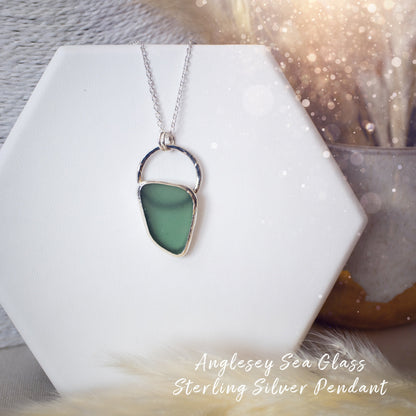 Beautiful deep green sea glass pendant set in 925 sterling silver and 999 fine silver. Featuring sea glass which has been hand picked off the local beaches in Anglesey North Wales