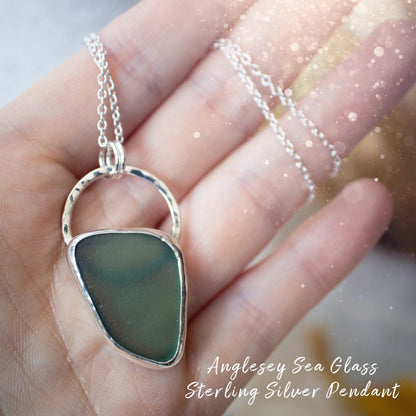 Beautiful deep green sea glass pendant set in 925 sterling silver and 999 fine silver. Featuring sea glass which has been hand picked off the local beaches in Anglesey North Wales