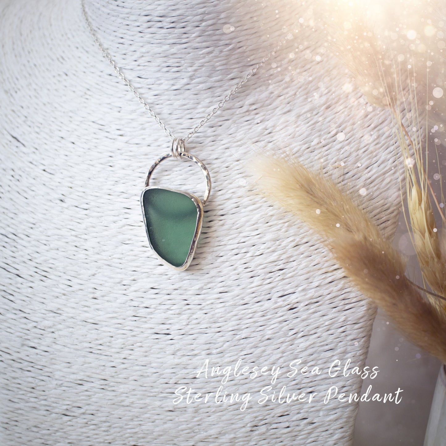 Beautiful deep green sea glass pendant set in 925 sterling silver and 999 fine silver. Featuring sea glass which has been hand picked off the local beaches in Anglesey North Wales