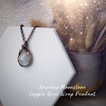 This is a one of a kind, handmade copper wire wrap pendant which features a natural flashy rainbow moonstone crystal. The rainbow moonstone crystal has a beautiful blue flash from different angles and compliments the highly polished, antiqued copper wire which shines luxury! Ideal gift for special occasions