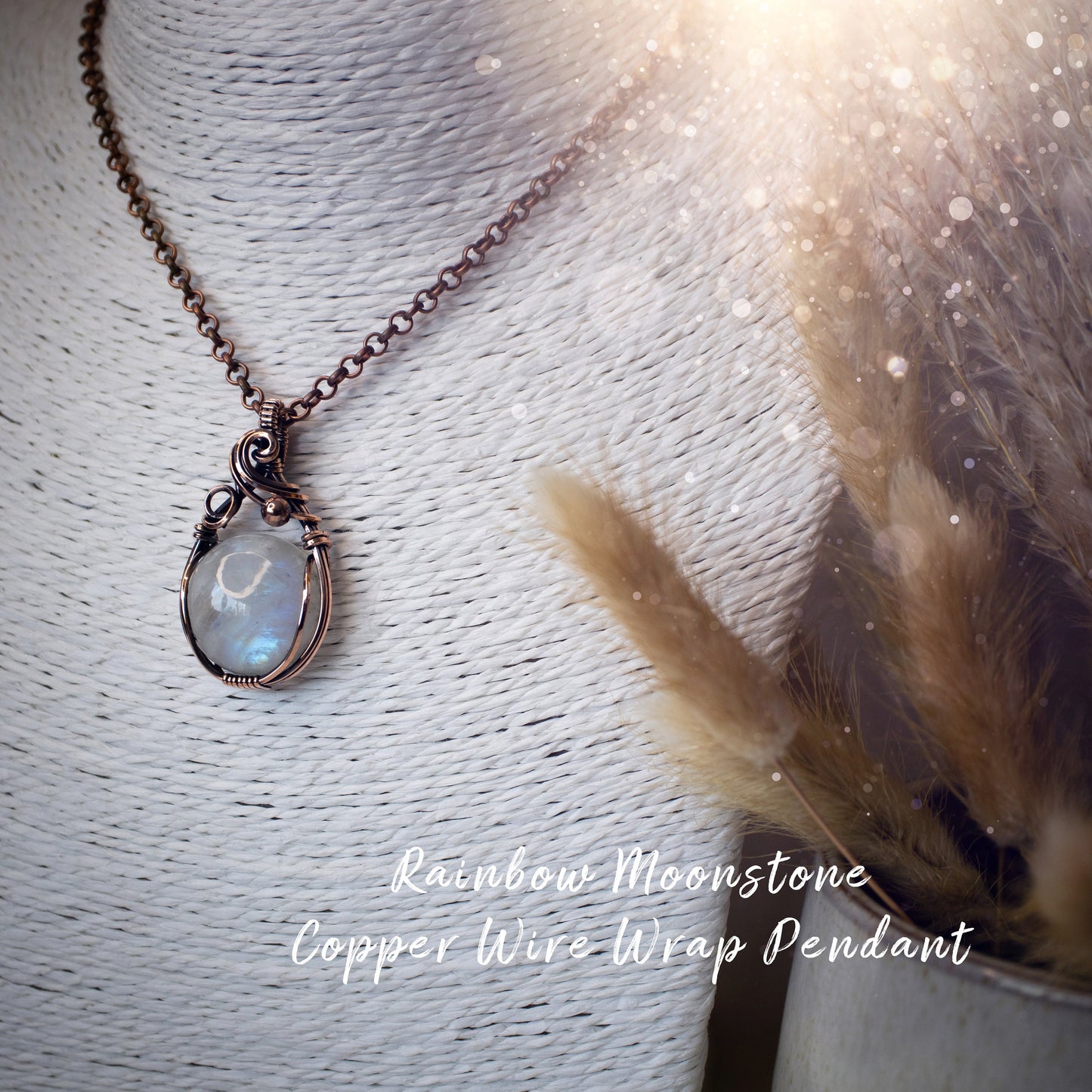 This is a one of a kind, handmade copper wire wrap pendant which features a natural flashy rainbow moonstone crystal. The rainbow moonstone crystal has a beautiful blue flash from different angles and compliments the highly polished, antiqued copper wire which shines luxury! Ideal gift for special occasions