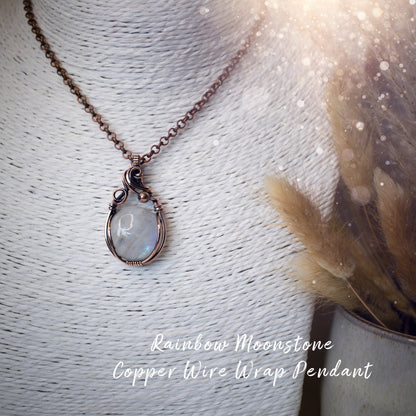 This is a one of a kind, handmade copper wire wrap pendant which features a natural flashy rainbow moonstone crystal. The rainbow moonstone crystal has a beautiful blue flash from different angles and compliments the highly polished, antiqued copper wire which shines luxury! Ideal gift for special occasions