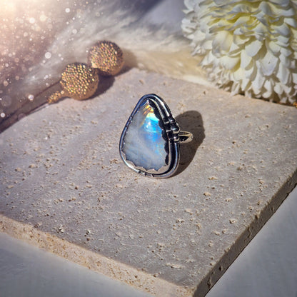 Beautiful Rainbow Moonstone ring set in fine and sterling silver. Featuring a scallop bezel, stars on the ring shank and silver accents. Size P. Gifts for friends, crystal lovers, gothic jewellery, hippy style.