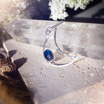 Royal Blue Kyanite moon necklace made from sterling silver and fine silver. The moon has been hammered for a sparkling effect. Beautiful gift for crystal and moon lovers. Celestial jewellery which has been handmade with love and care.