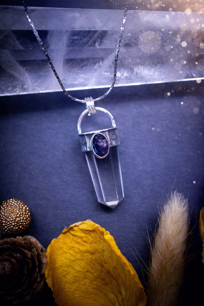 Beautiful, handmade Iolite and quartz crystal point pendant necklace. This pendant is a statement and has been handcrafted out of recycled fine and sterling silver. Featuring southwest stamp detail along the bezel. Ideal for crystal lovers, gothic.